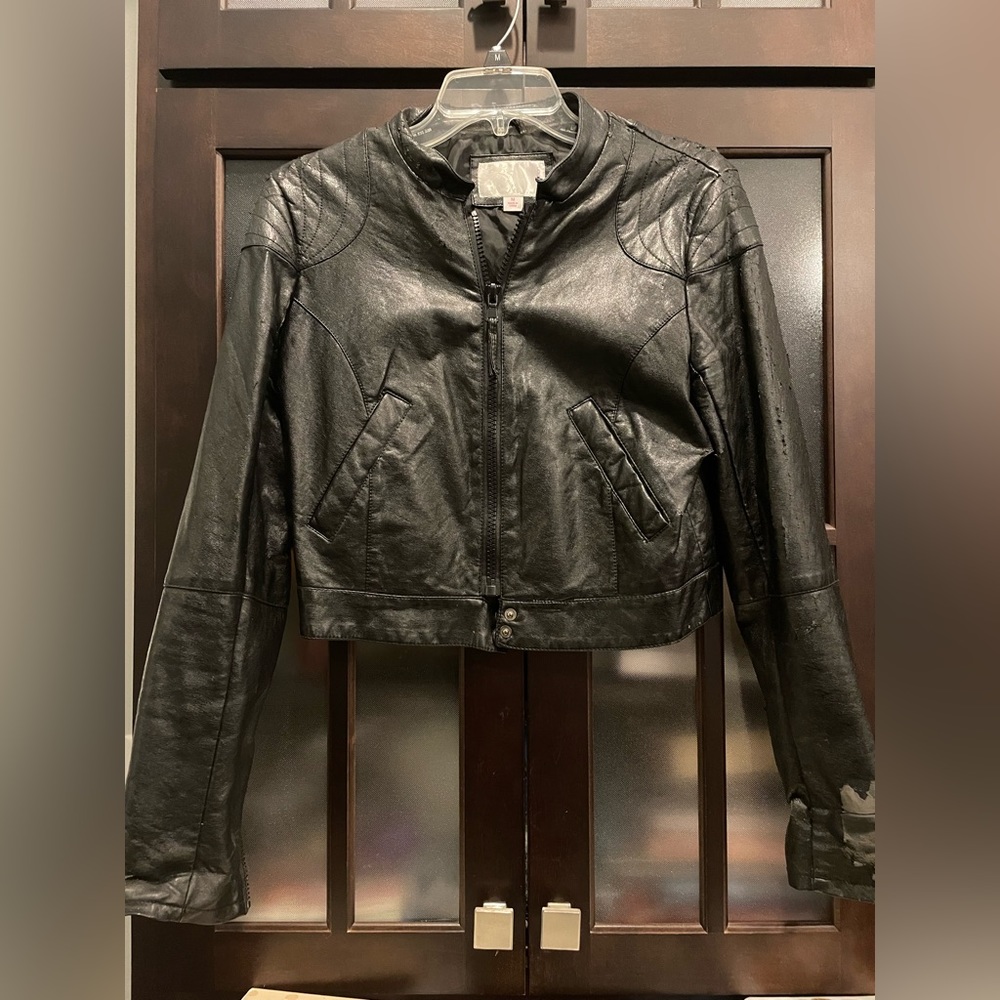 Black Faux Leather full zip jacket. With stylish zipper on sleeves.